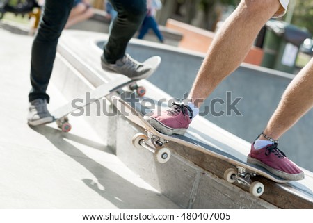 Guys riding skateboard