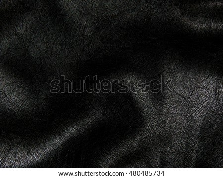 Texture of genuine black leather close up Royalty-Free Stock Photo #480485734