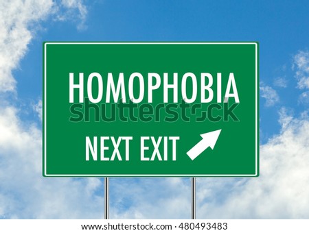 Next exit homophobia green road sign over blue sky background. Concept road sign collection.