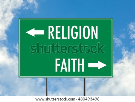 Religion vs Faith green road sign over blue sky background. Concept road sign collection.