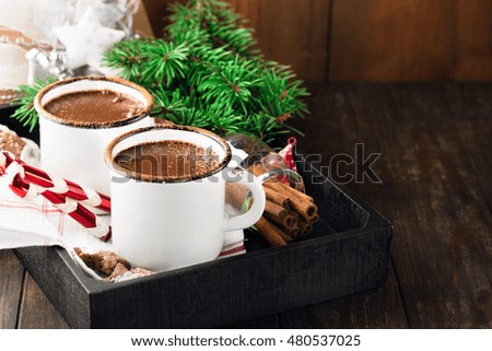 Christmas mugs of hot chocolate and homemade gingerbread cookies, selective focus. Christmas Holiday background, vintage style