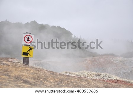The sign "Be careful" around geyser in Wai O Tapu, New Zealand