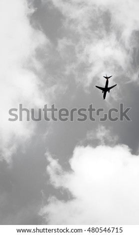 plane. Sky with plane. upside down of plane in sky. airplane in the sky. An airliner flying in the evening light. The blue sky with the white clouds in the summer sunny day.