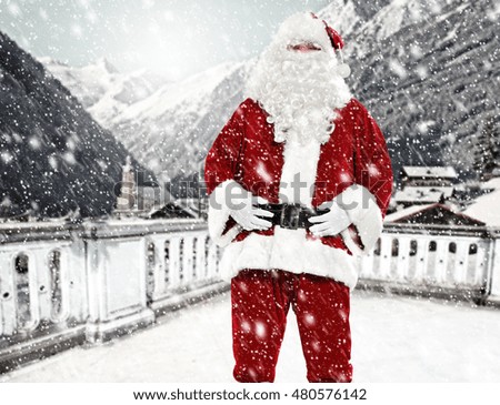 santa claus on terrace and winter day in Alps 