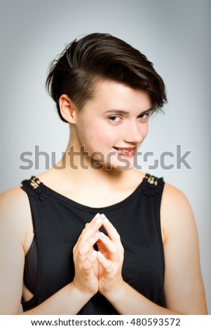 cunning business woman, portrait, isolated on gray background