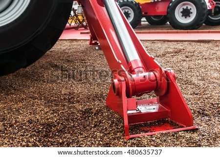 hydraulics crane support. hydraulics crane support is on gravel. focus on the hydraulics crane support