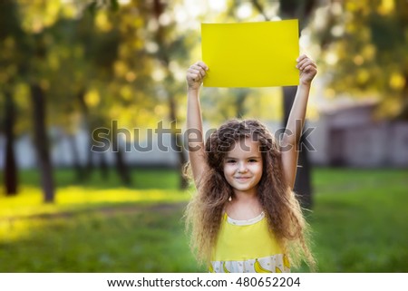 girl holding clean white sheet paper. banner for your message