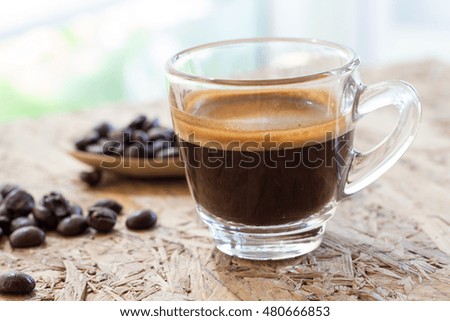 a cup of espresso coffee and bean 