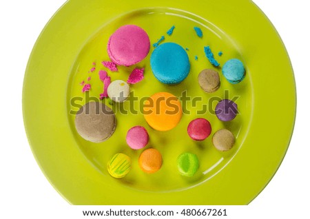 Colorful macaroons collection set on plate over white background