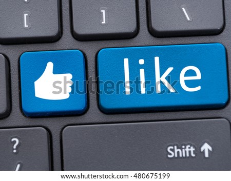 Keyboard with blue like button icon in close up as social media concept Royalty-Free Stock Photo #480675199