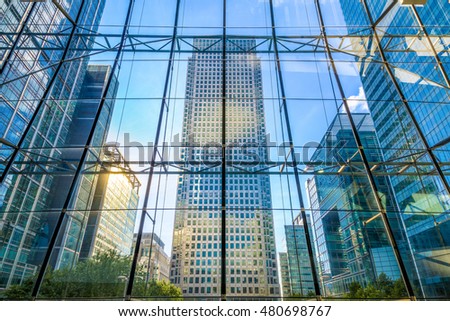 View of office buildings through glass window in Canary Wharf, financial district of London Royalty-Free Stock Photo #480698767