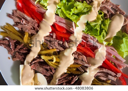 Diverse sliced appetizer with mayonnaise