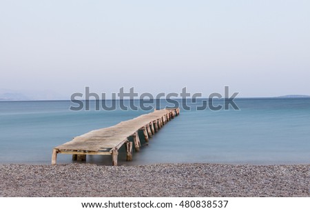 Wooden jetty at Ipsos beach, Corfu island, Greece