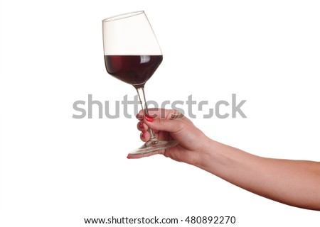female hand with red wine glass on a white background Royalty-Free Stock Photo #480892270