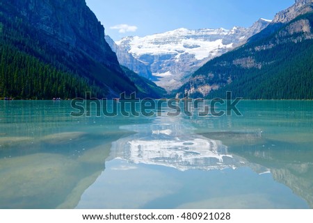 Alpine lake with reflections. Lake Louise. Banff National Park. Rocky Mountains. Alberta. Canada. 