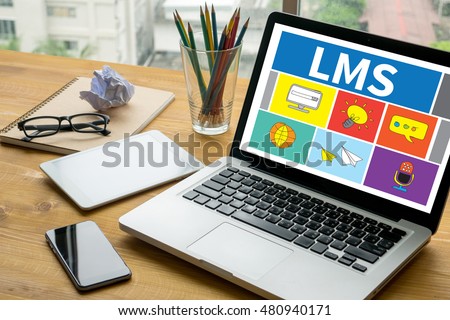 Learning Management System (LMS)  Laptop on table. Warm tone Royalty-Free Stock Photo #480940171