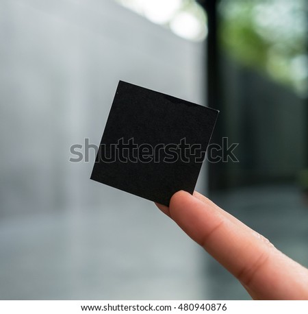 Finger hold paper card black. Use mockup