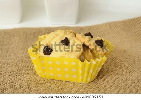 Dessert chocolate chips cookies delicious on a sackcloth on white table.