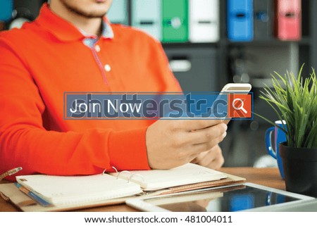 Young man using smartphone and searching JOIN NOW word on internet