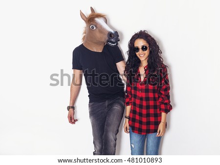 Crazy couple portrait posing together Royalty-Free Stock Photo #481010893