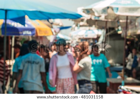 Tourists come to buy fresh seafood at "Angsila" market at Chonburi Province.Blur picture