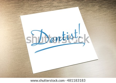 Dentist Sticky Note On Paper Lying On Golden Aluminium