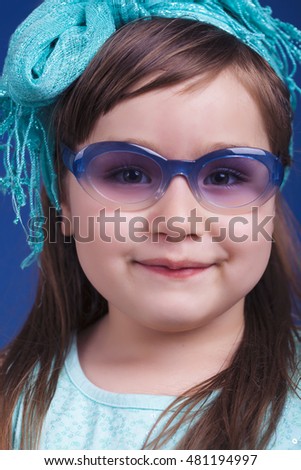 Cute Little Girl with Blue Sunglasses