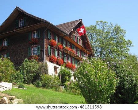 Traditional wooden Swiss House Royalty-Free Stock Photo #481311598