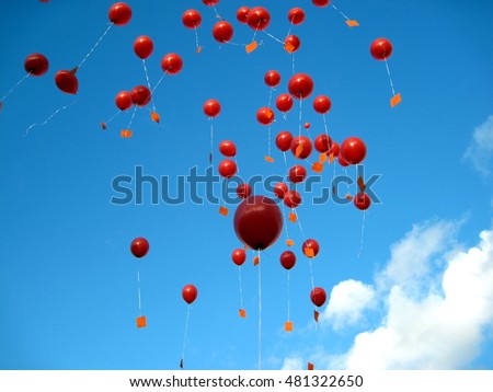 Red balloons in the Sky Royalty-Free Stock Photo #481322650