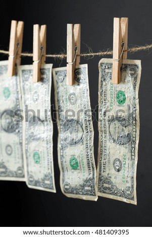 US dollar banknotes hanging on rope for money laundering conept