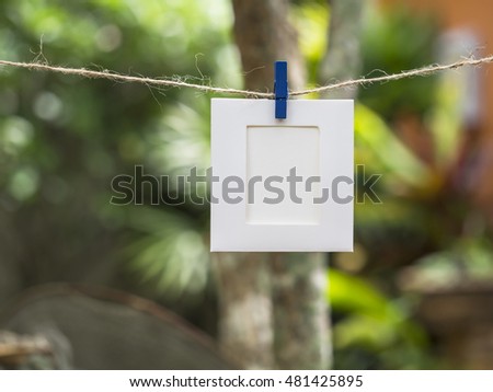 Photo Frames on Rope. background the nature, soft focus