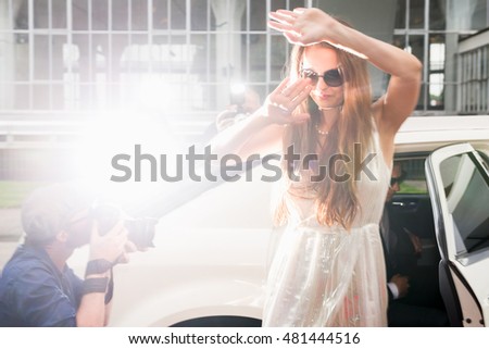 Elegant Woman Hiding Her Face From Paparazzi At Red Carpet