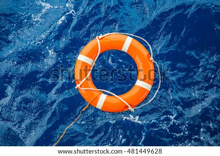 Safety equipment, Life buoy or rescue buoy floating on sea to rescue people from drowning man. Royalty-Free Stock Photo #481449628