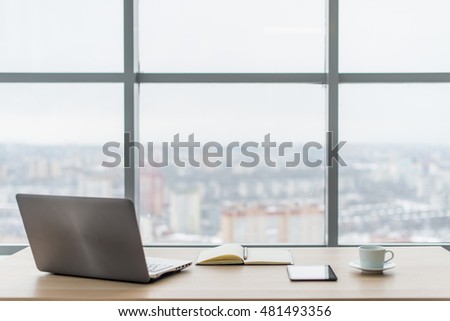 Office. Comfortable work table, workplace with notebook laptop. Royalty-Free Stock Photo #481493356
