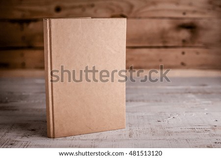 blank sketchbook on wooden background.jpg