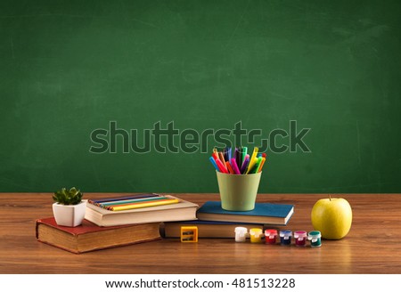 Back to school concept with clear blackboard background, desk, items