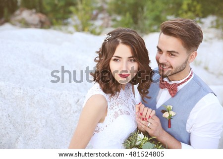 Bride and groom at their wedding day outdoors