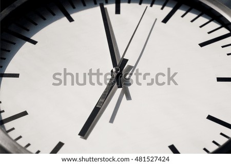 Black and white dial watch. Time running