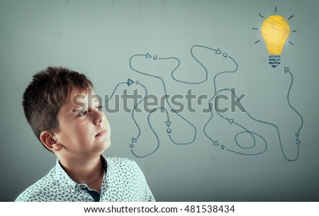Kid looking to a path leading to a lightbulb