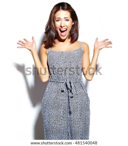 portrait of surprised fashion girl in casual hipster summer clothes with no makeup making  on white background 