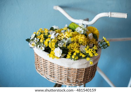 old bicycle with flowers on blue background