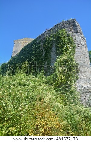 old castle wall ruins against a blue sky