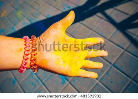 Colorful painted hands. Holi color festival.