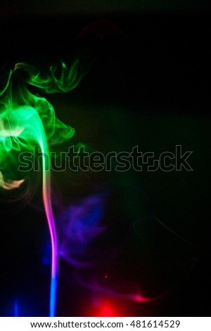 Smoke lit with Red, Blue, and Green LED lights on a black background.