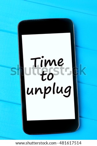 The words Time to unplug on smartphone display