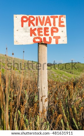 Private Keep Out warning sign in rural remote area