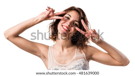 Pretty woman doing victory gesture