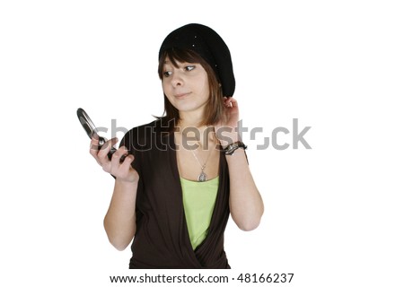 Happy young woman in black beret using cell phone isolated on white background