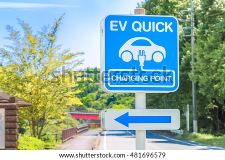 It was shot in Gunma Prefecture. Background is the mountain and the bridge and the trees and the road. / EV QUICK Charging Point Sign Boad / eco, sign