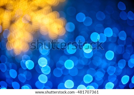 Christmas background whith blurred snowflake and blue lights